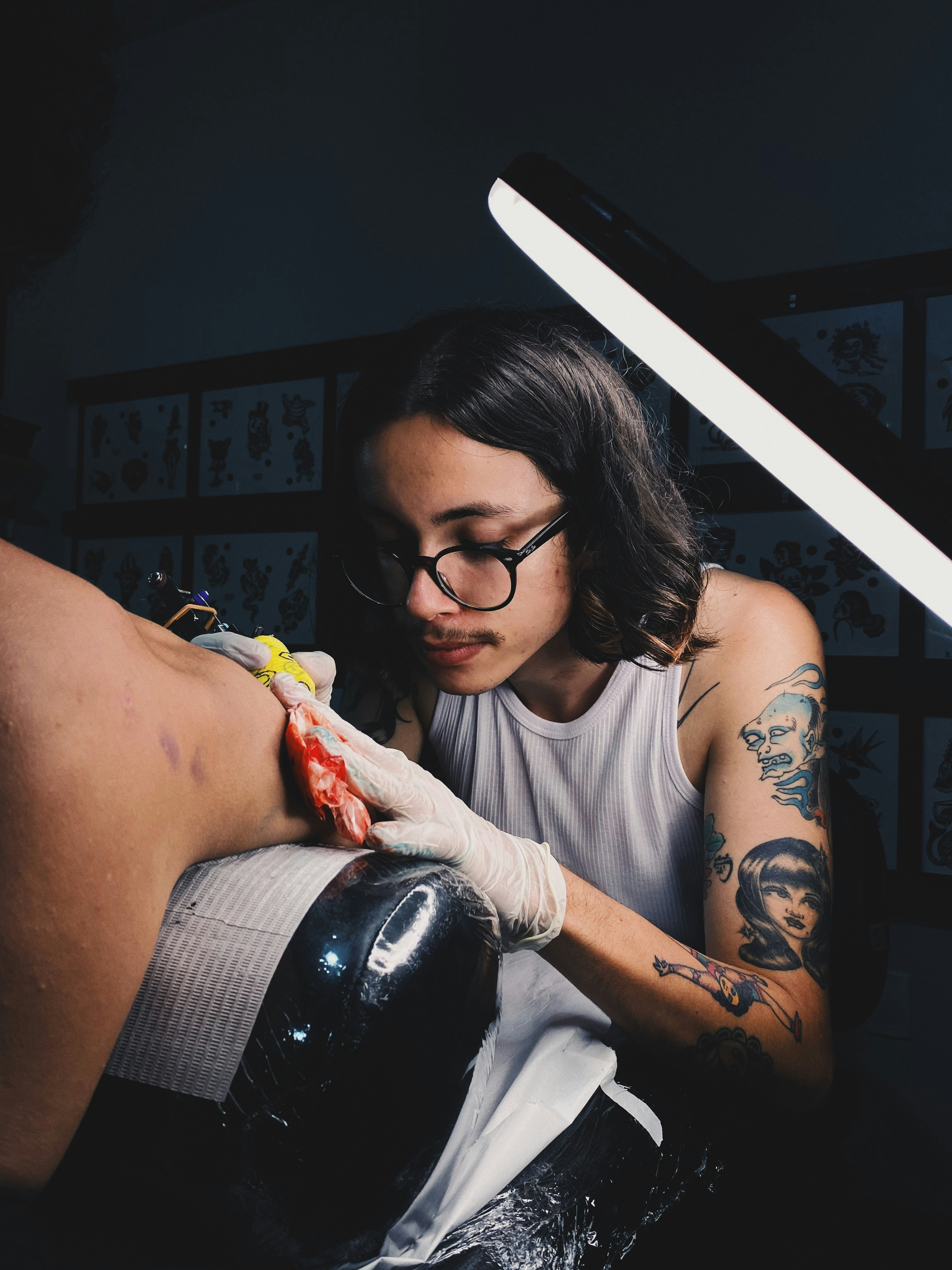 Sujan Gurung tattooing a mandala piece in the studio.