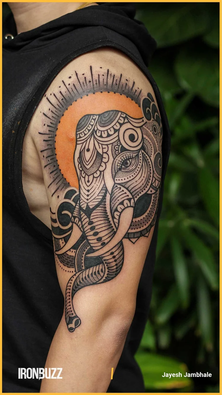 Detailed sacred geometric blackwork tattoo on a full sleeve.
